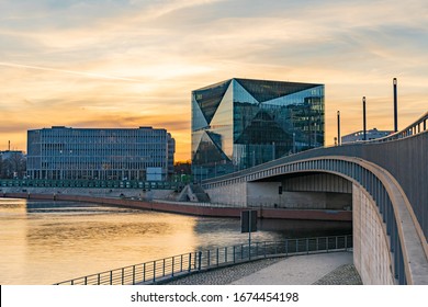 beautiful panoramic view at sunset, Berlin Spreebogen at Hugo-Preuss Bridge with a view of the Cube Berlin and John F. Kennedy House building at the main train station and the river Spree