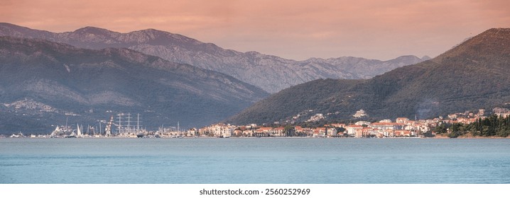 Beautiful panoramic view of Tivat, Montenegro with sailboats and luxury yachts during a summer sunset - Powered by Shutterstock