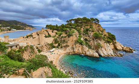 Beautiful panoramic view of Tossa de Mar fortification, rocky cliffs, trees and Es Codolar beach. Turquoise water of the Mediterranean Sea. Costa Brava, Catalonia, Spain - Powered by Shutterstock