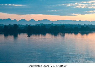 Beautiful panoramic views There are shiny fishing boats on the Mekong River that separates Thailand and Laos in the morning. The background is mountains. There is light sunlight. light - Powered by Shutterstock