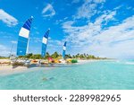 beautiful paradise beach of Varadero in Cuba on a sunny summer day. Beautiful seascape with clear turquoise water. sailing ships are parked on the sand.