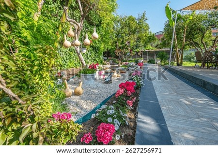 Beautiful park and garden decoration with dried water pumpkins 