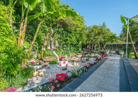Beautiful park and garden decoration with dried water pumpkins 