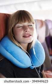 Beautiful Passenger Sleeping On Plane