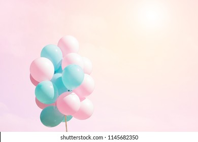 Beautiful pastel background with pink and blue flying balloons in pink sky. Bunch of flying balloons on soft background. Concept of happiness, joy, Love, wedding. Holiday Web Banner With Copy Space. - Powered by Shutterstock