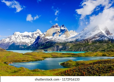 Beautiful Patagonia landscape of Andes mountain range, winding road and lake at Torres del Paine National Park, Chile. 
