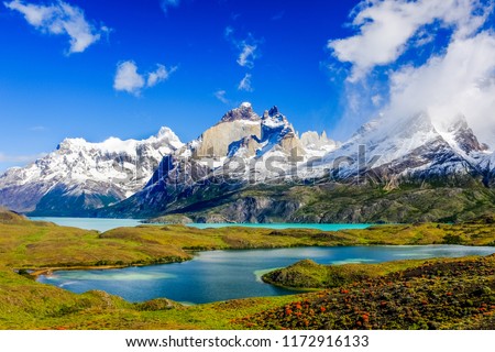 Beautiful Patagonia landscape of Andes mountain range, winding road and lake at Torres del Paine National Park, Chile. 