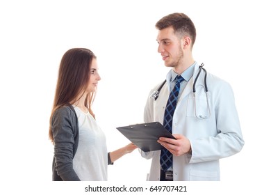 Beautiful Patient Looks At A Primary Care Physician In The White Robe Is Isolated On A White Background