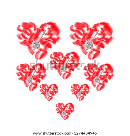 beautiful pattern of hearts of various sizes on a white background. red feathers and silver keys in the form of decorative elements. flat lay, top view, concept holiday