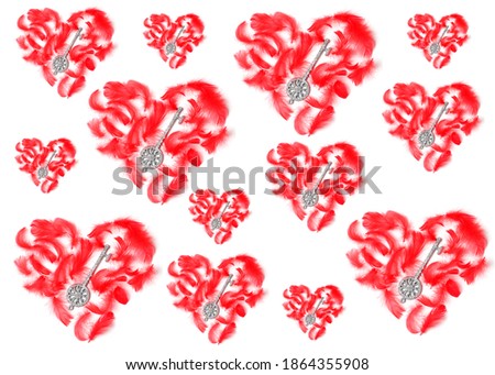 beautiful pattern of hearts of various sizes on a white background. red feathers and silver keys in the form of decorative elements. flat lay, top view, concept holiday.