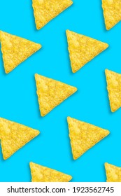 Beautiful pattern made from Potato chips on light blue background