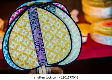 Beautiful pattern on Thai native fan made from bamboo for sale in the local market. Handmade bamboo fan traditional of Thailand