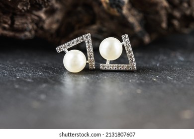 A beautiful Pearl Ear studs. Close-up of white pearl earrings.
