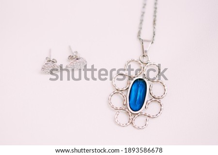 Beautiful pendent with blue stone. 