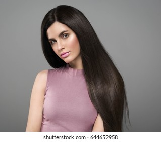 Beautiful perfect hair woman portrait. Studio shot. Gray background. - Shutterstock ID 644652958