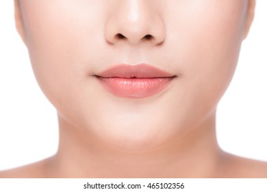 Beautiful Perfect Lips. Sexy Mouth Close Up. Beauty Young Asian Woman Lips. Close Up Over White Background