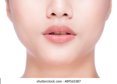 Beautiful Perfect Lips. Sexy Mouth Close Up. Beauty Young Asian Woman Lips. Close Up Over White Background