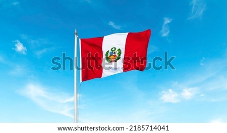 beautiful Peruvian flag waving with blue sky in the background