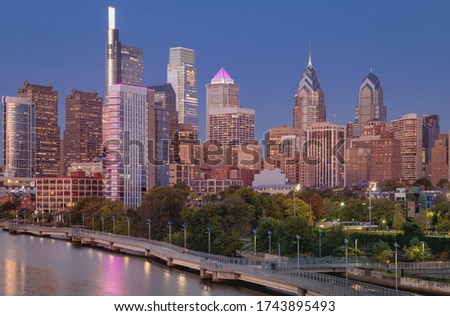 Beautiful Philadelphia Cityscape Skyline with Skyscrapers in Background. Golden Hour Light and Clear Blue Sky