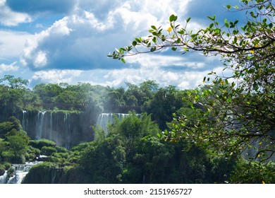 Beautiful Photo Of The Iguaçu Falls, In A Region Of Dense Forest, On A Sunny Day With Blue Sky