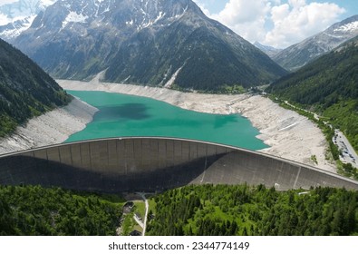 A beautiful photo off a reservoir between the mountains in Austria