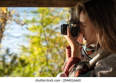 Beautiful Photogrpapher Woman Taking Photo On A Fil Camera In Nature