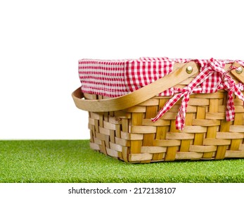 A Beautiful Picnic Basket On A Background Of Green Lush Grass. Minimalism. There Are No People In The Photo. There Is Free Space To Insert. Rest, Relaxation, Romance.