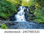 beautiful picturesque strong bubbling waterfall in the ruskeala mountain park in karelia in russia