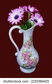 Beautiful Pink African Daisy flower in a decorative ceramic vase isolated on a marone-coloured background. Fresh flowers close up. Wall art and decoration image. - Shutterstock ID 2231984425