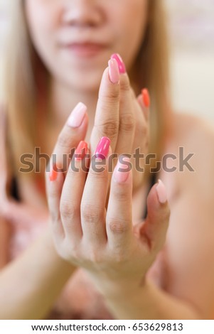 beautiful pink fingernail manicure acrylic nail polish of woman hand beauty fashion