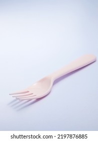 Beautiful Pink Fork On A White Background