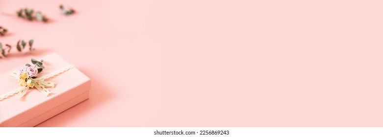 Beautiful pink gift box isolated on pastel background. Gift for holiday, birthday, Wedding, Mother's Day, Valentine's day, Women's Day. Copy space. Top view, flat lay. Banner - Powered by Shutterstock