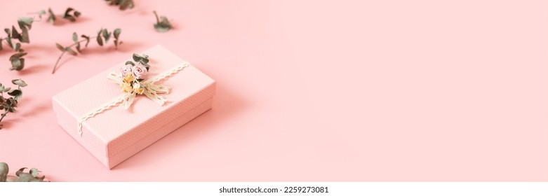 Beautiful pink gift box isolated on pastel background. Gift for holiday, birthday, Wedding, Mother's Day, Valentine's day, Women's Day. Copy space. Top view, flat lay. Banner - Powered by Shutterstock