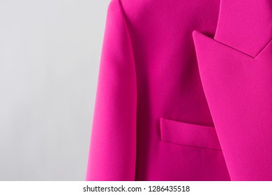 Beautiful Pink Jacket On White Background. Closeup Pocket And Lapel. Stylish Modern Clothing.