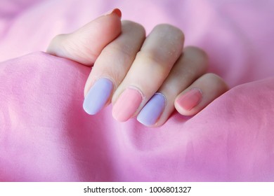 Beautiful Pink Nail Polish. Female Hands with Pink Nails Manicure on Pink Fabric Background Great for Any Use.