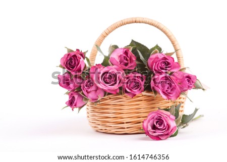 Beautiful pink roses in a wicker basket on a white background. Isolate Concept Valentine's Day, Mother's Day. Holiday gift.
