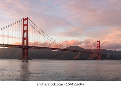 Beautiful pink sunset over the iconic Golden Gate Bridge in San Francisco, California. - Powered by Shutterstock