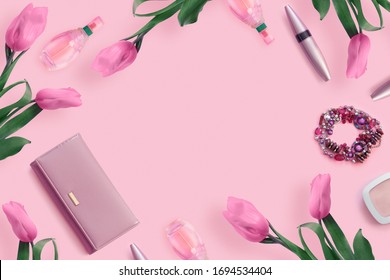 Beautiful pink tulips with  leather purse,  cosmetics on  pink paper background. Top view, flat lay, copy space concept - Powered by Shutterstock