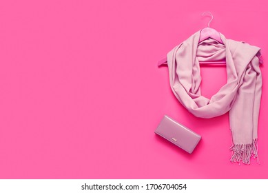 Beautiful pink woolen scarf and beautiful leather wallet on paper background. Top view, flat lay, copy space concept.
 - Shutterstock ID 1706704054