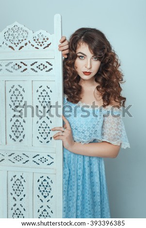 Beautiful Plump Brunette Looking From Behind The Screen Wearing Her Dress Beautiful Plump Brunette Looking From Behind The Screen Wearing Her Dress