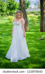 Beautiful Plus Size Bride At Park In Her Wedding. Wedding Concept