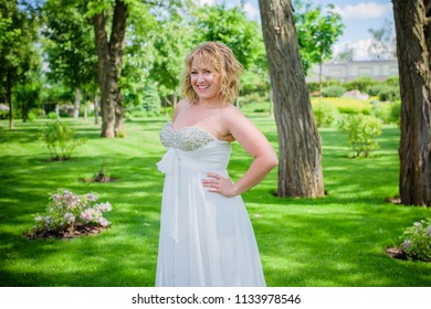 Beautiful Plus Size Bride At Park In Her Wedding. Wedding Concept