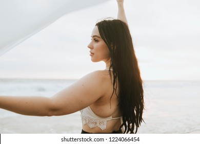 Beautiful plus size model at the beach