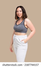 Beautiful Plus Size Model Smiling In Sport Outfit Yoga Outfit Isolated On Beige