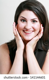 Beautiful Plus Size Model Surprised And Press Her Hands To Face With Charming Smile