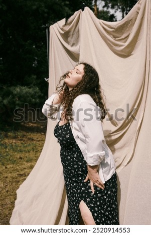 Similar – barefoot young woman sitting barefoot in a window frame