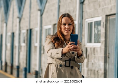 Beautiful Plus Size Woman With Mobile Phone In The Street Taking A Selfie