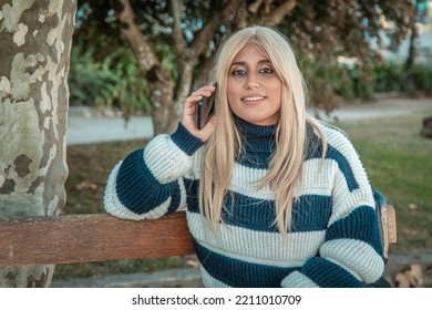 Beautiful Plus Size Woman With Phone In Autumn