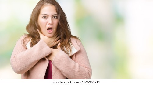 Beautiful plus size young woman wearing winter coat over isolated background shouting and suffocate because painful strangle. Health problem. Asphyxiate and suicide concept.