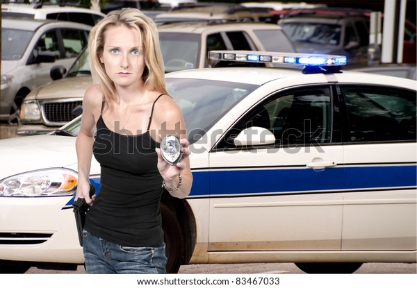 A\
beautiful police detective woman on the job with a\
gun